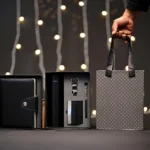 5-in-1 corporate gift set in a black box with a white notebook, thermos, accessories, and a matching gift bag.