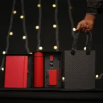 5-in-1 corporate gift set in a black box with a white notebook, thermos, accessories, and a matching gift bag.