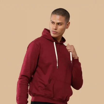 A man wearing a black hoodies with white drawstrings
