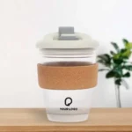Chic glass mug with cork grip, adding a touch of sophistication to your drinkware