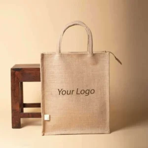 Rectangular jute shopping bag with a top zipper, matching brown handles, and "Your Logo" printed on the front.