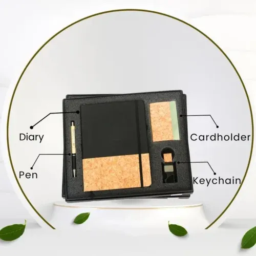 Employee Welcome Kit: Eco-friendly black gift set with cork accents: a diary, pen, cardholder, and stylish keychain, presented in a custom box.