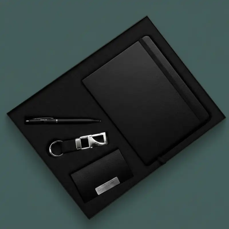 Deluxe black Employee Welcome Kit with notebook, pen, keychain, and card holder in a black box.