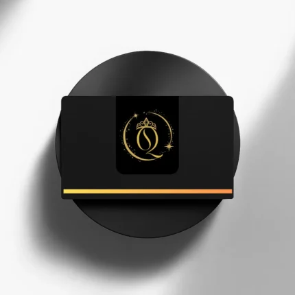 Black business card featuring a gold crowned "Q" logo inside a celestial circle, displayed on a black circular pedestal